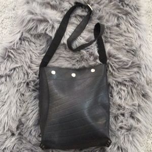 Two’s Company woman’s black tire tube bag